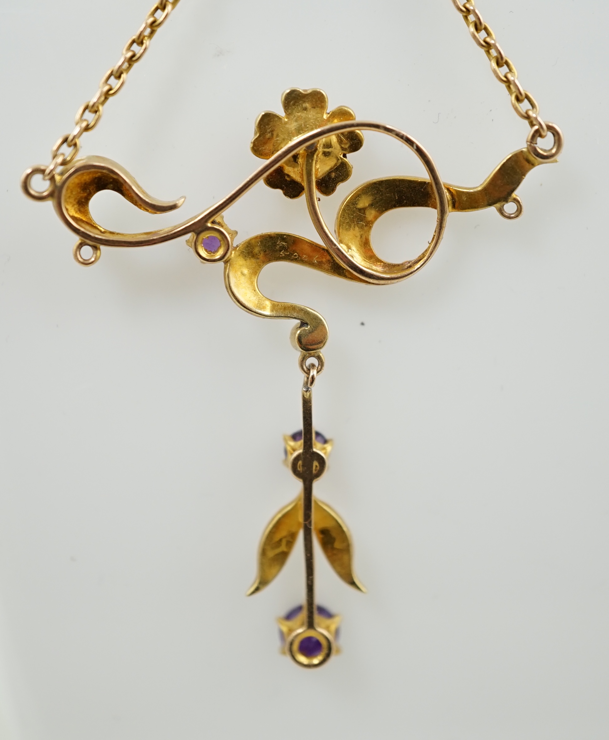 An Edwardian 15ct gold, seed pearl and amethyst set drop necklace and a pair of matching unmarked earrings